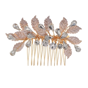 Detailed close-up of golden hair comb with lavender leaves and sparkling rhinestones
