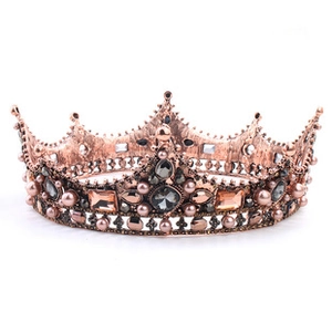Detailed macro view of baroque crown featuring vintage bronze alloy and grey rhinestones