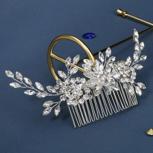 Detail showing handcrafted bridal hair comb with silver marquise rhinestones and leaves
