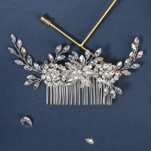 Macro shot of silver bridal hair comb with marquise rhinestones and crystal leaf details