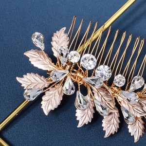 Exquisite gold bridal hair comb with rose gold metal leaves and sparkling rhinestones