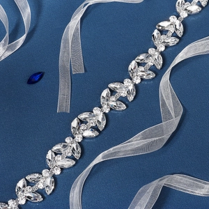 Detailed close-up of luxury marquise rhinestone bridal belt with shimmering silver leaf patterns