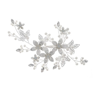Detailed macro of silver floral hairpiece featuring metal leaves and white faux pearls