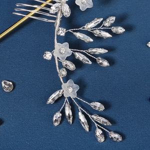 Detail of silver wire bridal hair comb with marquise crystals and acrylic flowers