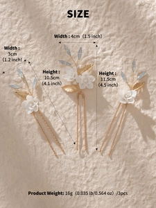 Detail of 3-piece bridal hair pin set with white ceramic flowers and blue beads