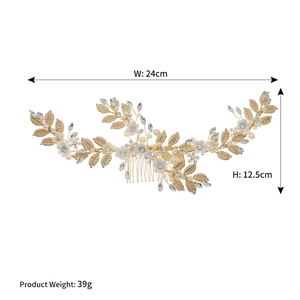 Detailed view of 24cm bridal hair comb with gold alloy leaves, pearls and white flower petals