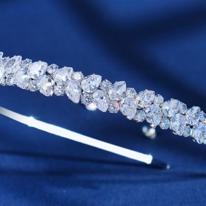Luxurious silver crown headband with pear and round cubic zirconia on navy velvet