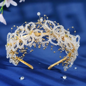 Elegant gold bridal headpiece with crystal bead floral clusters on blue silk