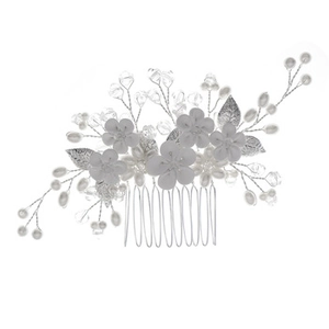 Vue détaillée du peigne à cheveux artisanal avec fleurs en résine et perles