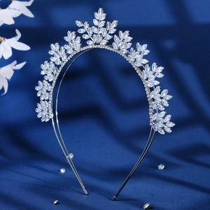 Elegant silver bridal headband with marquise crystals in leaf pattern on blue velvet