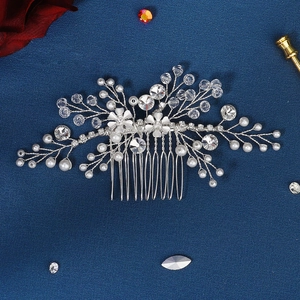 Silver bridal hair comb with white pearls, crystals, and flowers for elegant wedding updos