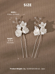 Detail showing dimensions of two handmade ceramic flower hair pins with crystal beads
