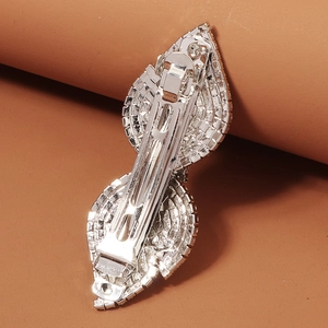 Detailed back view of silver spring hair clip showing the metal mechanism and rhinestones