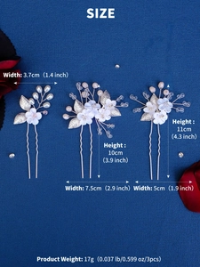 Detail view of bridal hair pin set featuring handmade white ceramic flowers and pearls