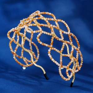 Luxurious handmade woven crystal headband with orange and champagne beads for parties