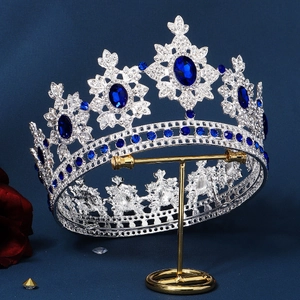 Detail of luxury silver tiara with deep blue oval gemstones and sparkling crystals
