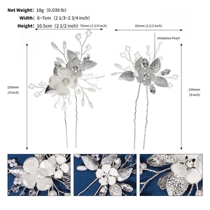 Detailed view of silver bridal hair pins with white flowers, pearls and crystal accents