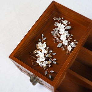 Elegant handmade bridal hair comb set with ceramic flowers pearls and gold leaves