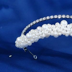 Elegant double-layered headband featuring rows of white pearls and sparkling square crystals