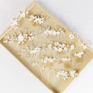 Elegant bridal hair comb set with ceramic flowers and pearls in a display box