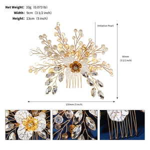 Detailed close-up of handmade bridal hair comb with gold wires, pearls and crystals