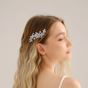 Close-up of zircon flower bridal hair comb with marquise crystals on bride's hair