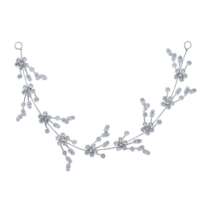 Elegant bridal hair vine with silver floral crystals and leaf patterns on white background