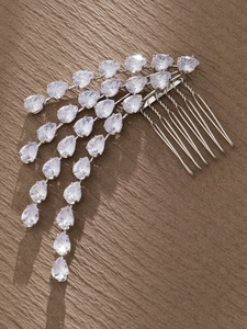 Detailed close-up of silver bridal hair comb with shimmering teardrop zircon tassels