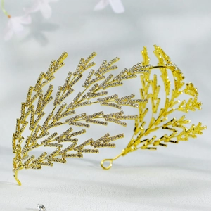 Detail view of golden branch bridal headpiece with sparkling crystal rhinestones