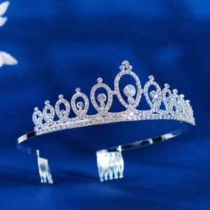 Silver bridal tiara with sparkling rhinestones and integrated hair combs for wedding