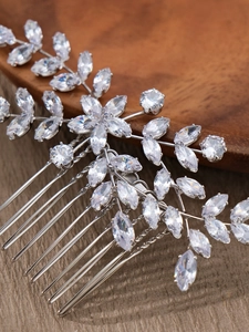 Close-up of bridal flower hair comb with silver marquise and round cubic zirconia crystals