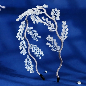 Detail of beaded bridal headband with crystal branches and teardrop droplets