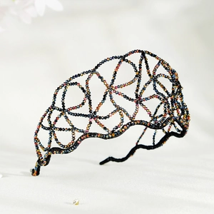 Detailed view of handmade crystal beaded headband with shimmering multi-color AB rhinestones