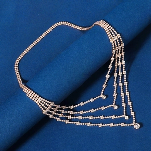 Detail of rose gold fringe head chain with four-layer rhinestone tassels and round crystals