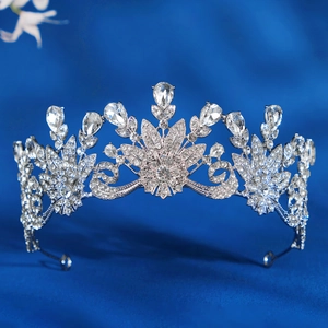 Close-up of elegant silver bridal tiara with sparkling crystal floral patterns