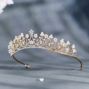 Elegant bridal crown with white pearls and sparkling rhinestones on gold alloy frame