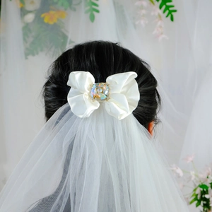 Elegant white satin bow hair clip with crystal rhinestones and bridal veil for women