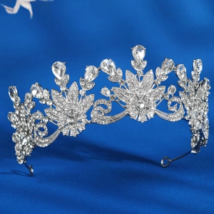 Detailed macro shot of bridal crown featuring pear-cut rhinestones and silver metal filigree