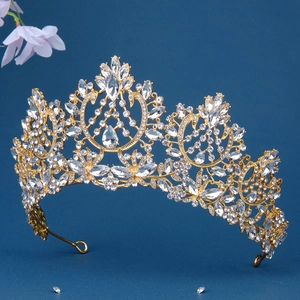 Detailed macro view of luxurious gold baroque crown with clear rhinestones and crystals
