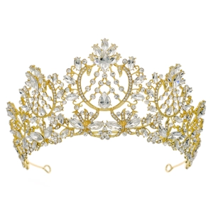Detail of baroque gold bridal crown with teardrop crystals and intricate rhinestone inlay