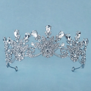 Macro detail of silver bridal crown with glittering rhinestones and crystal flower patterns