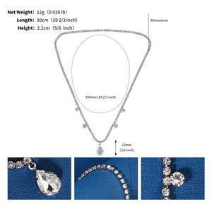 Detailed macro view of silver rhinestone forehead chain with sizing and weight specs