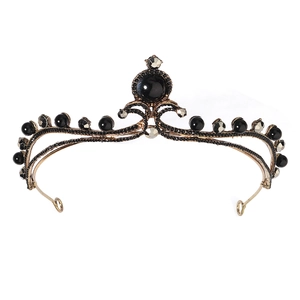 Baroque style bronze bridal crown with black pearls and rhinestones on white background
