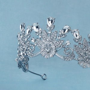 Elegant bridal crown with sparkling rhinestones and silver metal floral leaf design