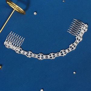 Elegant bridal hair comb with silver rhinestone chain accessory for wedding hairstyling