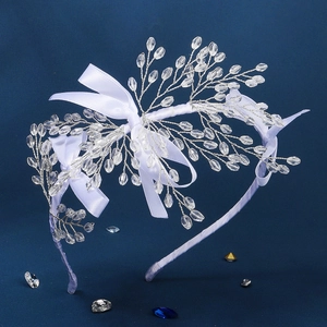 Serre-tête de mariée fait main avec branches en cristal argenté et nœuds en satin blanc