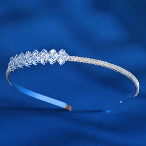 Close-up of elegant silver bridal headband featuring square and round zircon crystals
