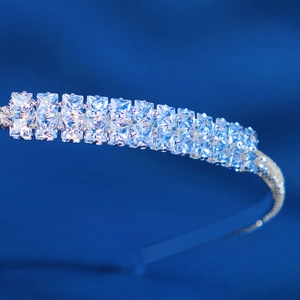 Macro detail of double-row square-cut cubic zirconia inlays on bridal headband
