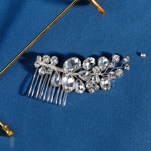Detailed close-up of handmade bridal hair comb with silver finish and marquise crystals