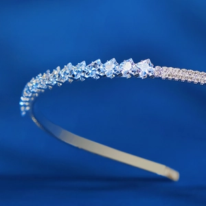 Macro detail of silver bridal headband featuring square cut zircons and pavé setting